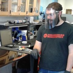 student working in facemask